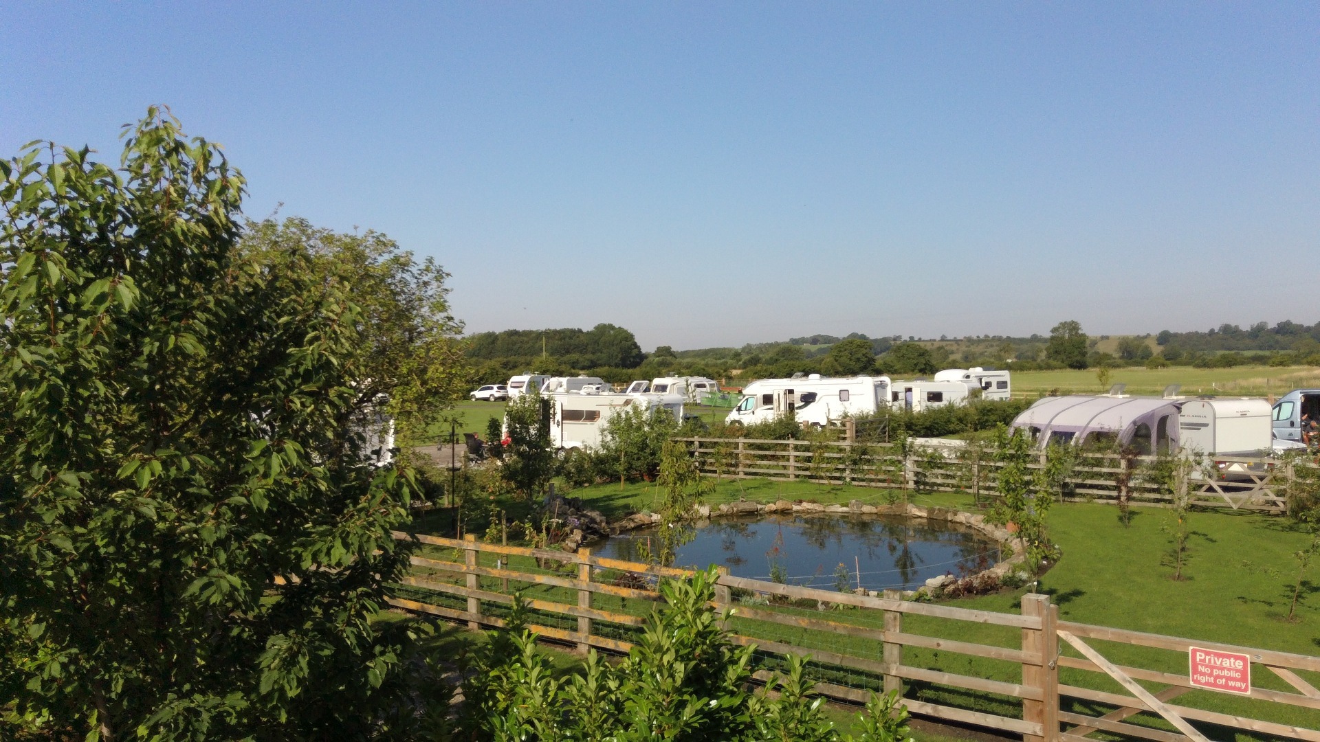 View of pond with caravan park in the background